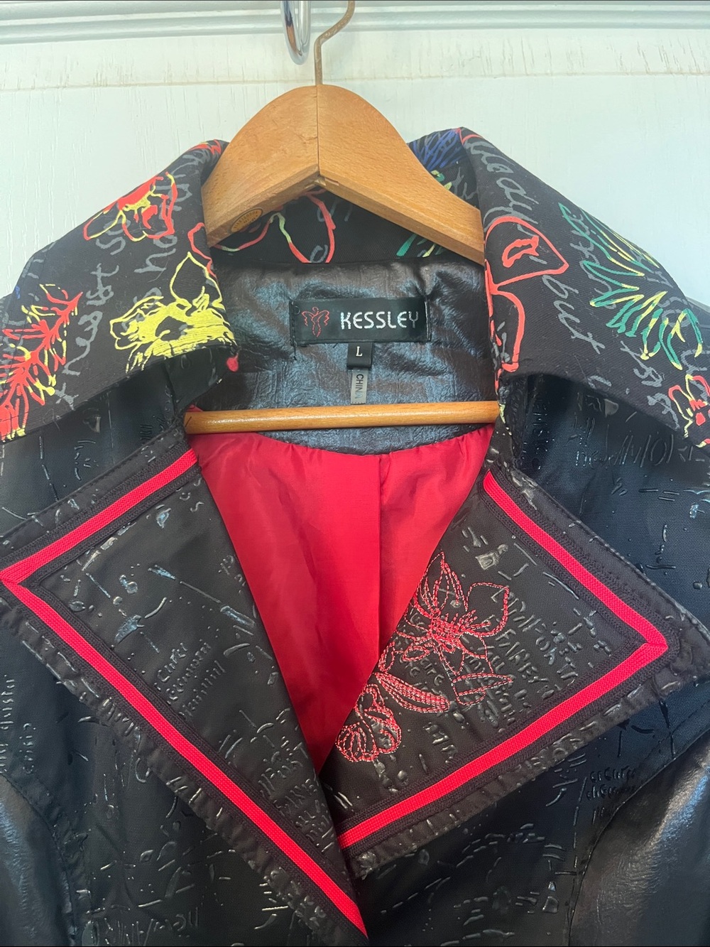 Black Embroidered Faux-Leather Coat with Red Trim
